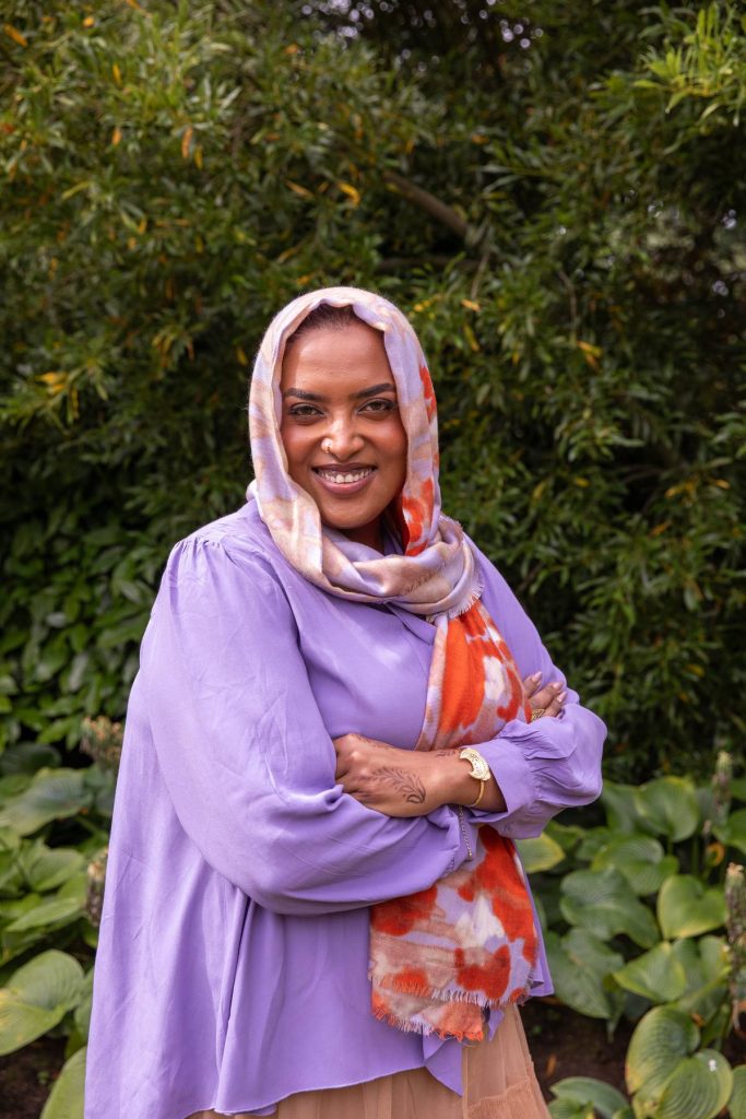 Dr. Ala Farah from AfroConnectNZ posing for the camera